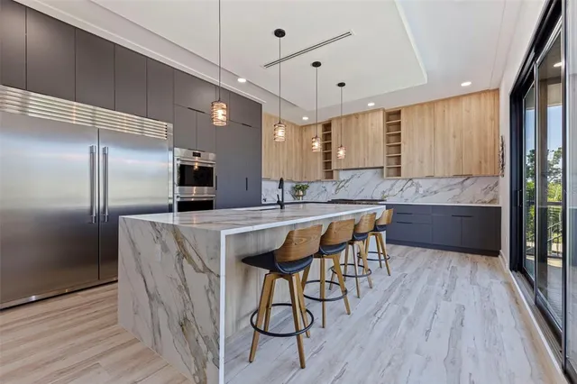 a view of an empty room with window and a ceiling fan