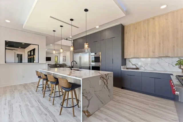 a view of a kitchen from the hallway