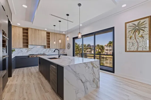 a kitchen with a stove and a sink