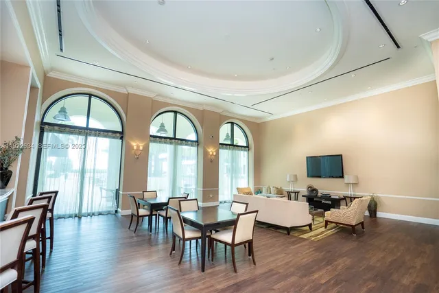 a view of a livingroom with furniture window and wooden floor