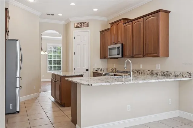 a bathroom with a granite countertop sink mirror and toilet