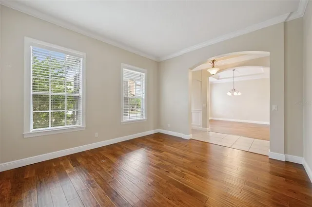 a kitchen with stainless steel appliances granite countertop a refrigerator a stove a sink a microwave and island