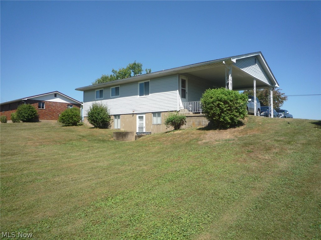 78 Holdren Road Little Hocking, OH 45742 - Photo 5 of 25 Back view of the house showing the walk-out basement.