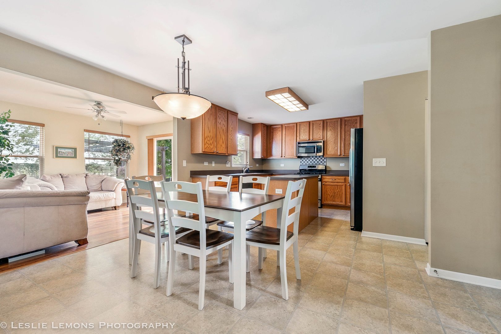 128 Reston Court Sycamore, IL 60178 - Photo 2 of 30 a kitchen with kitchen island a dining table chairs and a oven