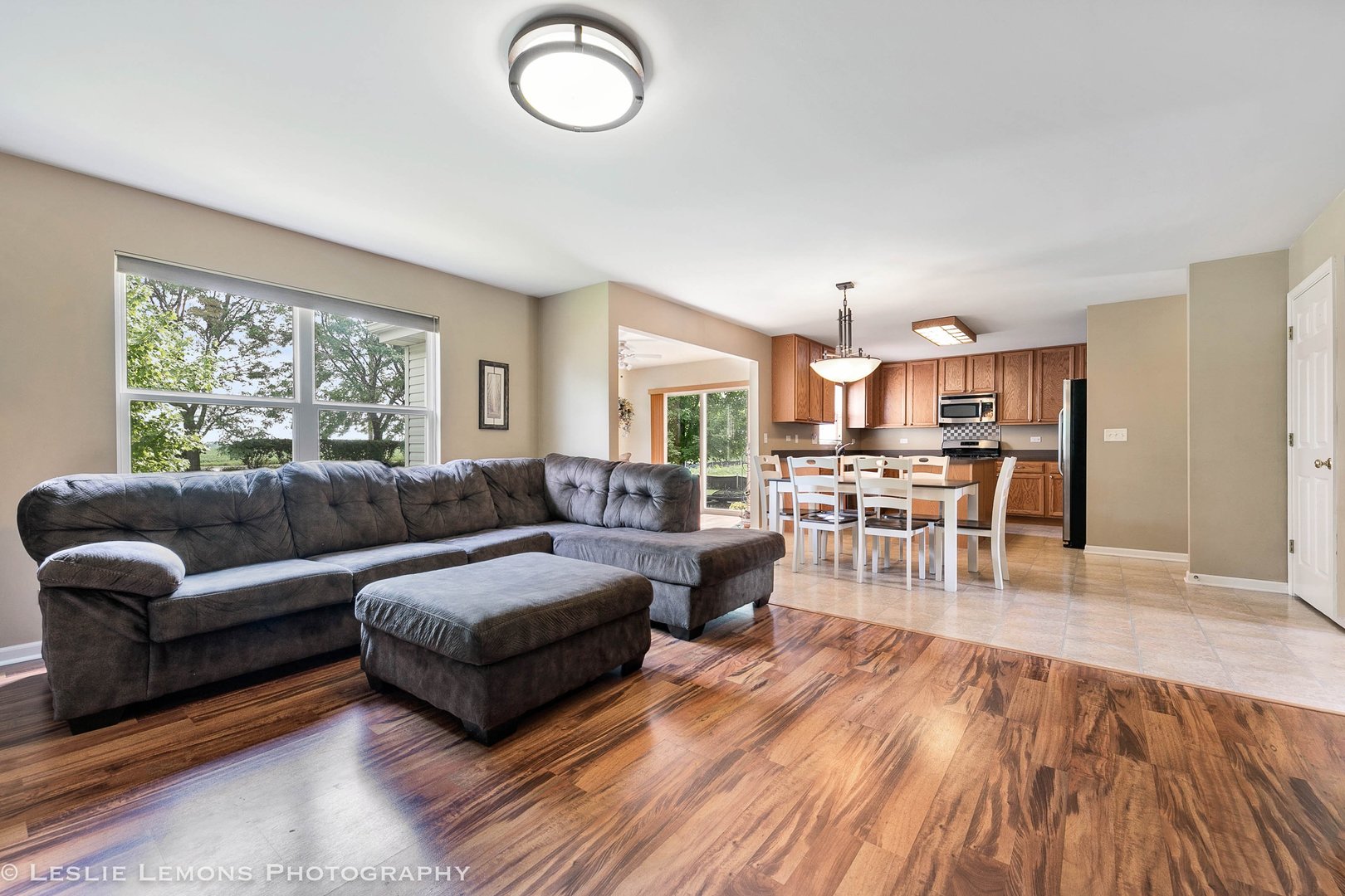 128 Reston Court Sycamore, IL 60178 - Photo 15 of 30 a living room with furniture wooden floor and a large window