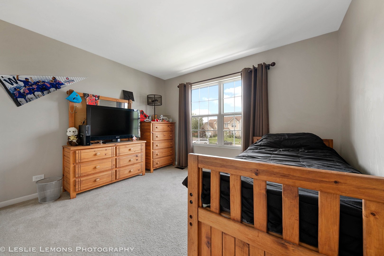 128 Reston Court Sycamore, IL 60178 - Photo 22 of 30 a kitchen with furniture a flat screen tv and a window