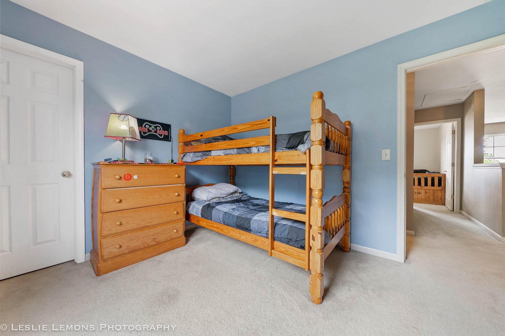 128 Reston Court Sycamore, IL 60178 - Photo 23 of 30 a bedroom with a bed and a dresser