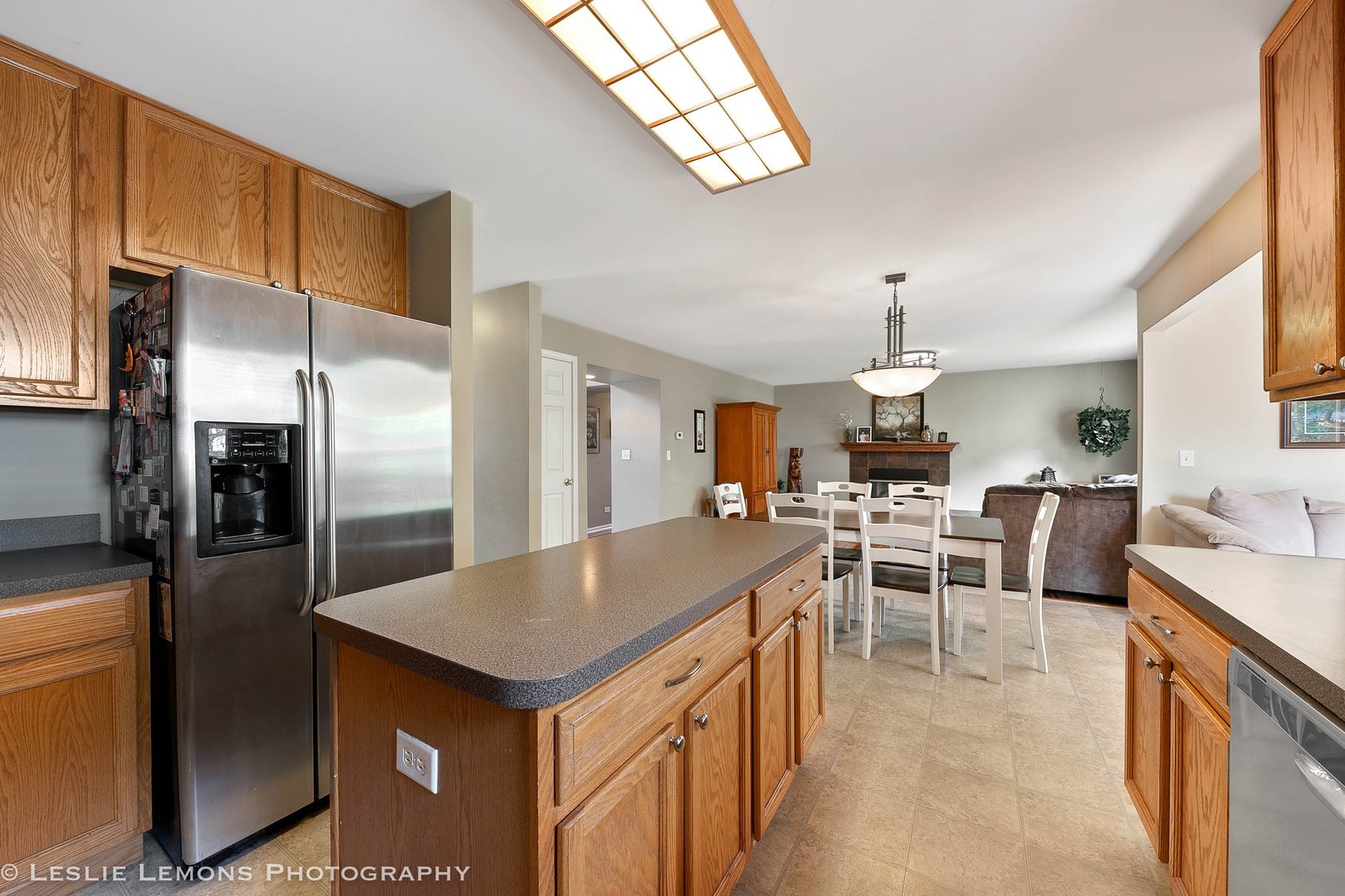 128 Reston Court Sycamore, IL 60178 - Photo 6 of 30 a open kitchen with stainless steel appliances kitchen island a table chairs sink and cabinets