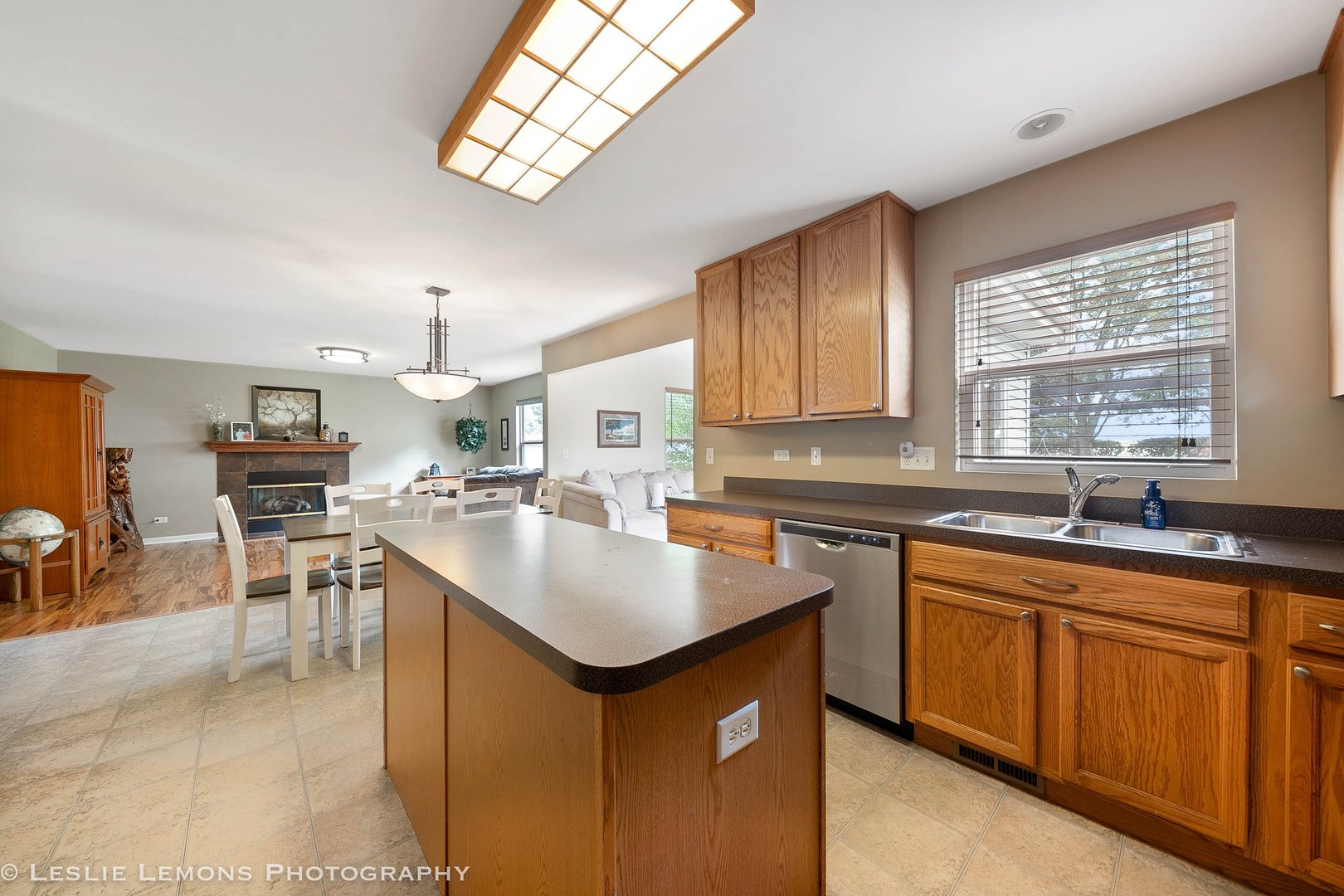 128 Reston Court Sycamore, IL 60178 - Photo 8 of 30 a kitchen with a sink stove cabinets and dining table