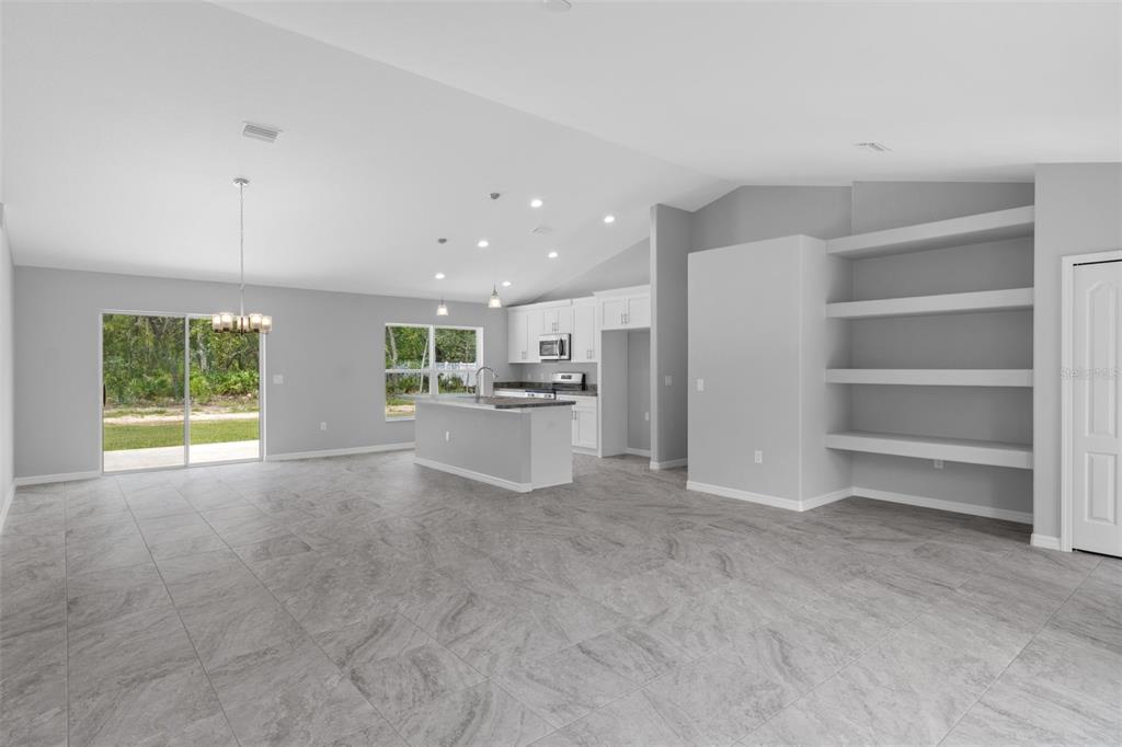 16375 Kakawi Road Brooksville, FL 34614 - Photo 7 of 30 a view of a kitchen with a sink and a window