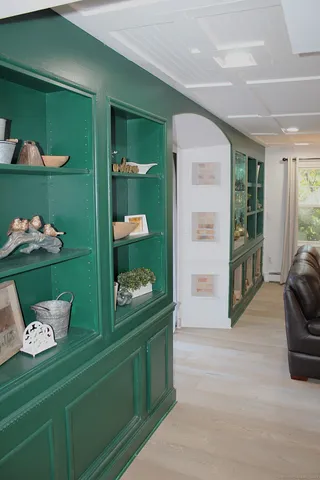 a room with window and cabinet