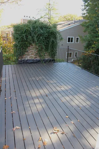 a view of a house with a wooden deck