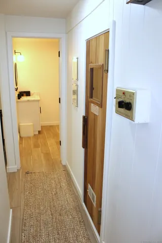 a bathroom with a toilet a sink and a mirror