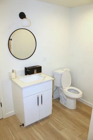 a view of a door and wooden floor