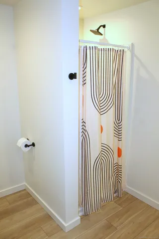 a view of a backyard with furniture and a tub