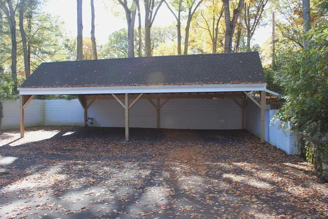 a view of a house with a backyard