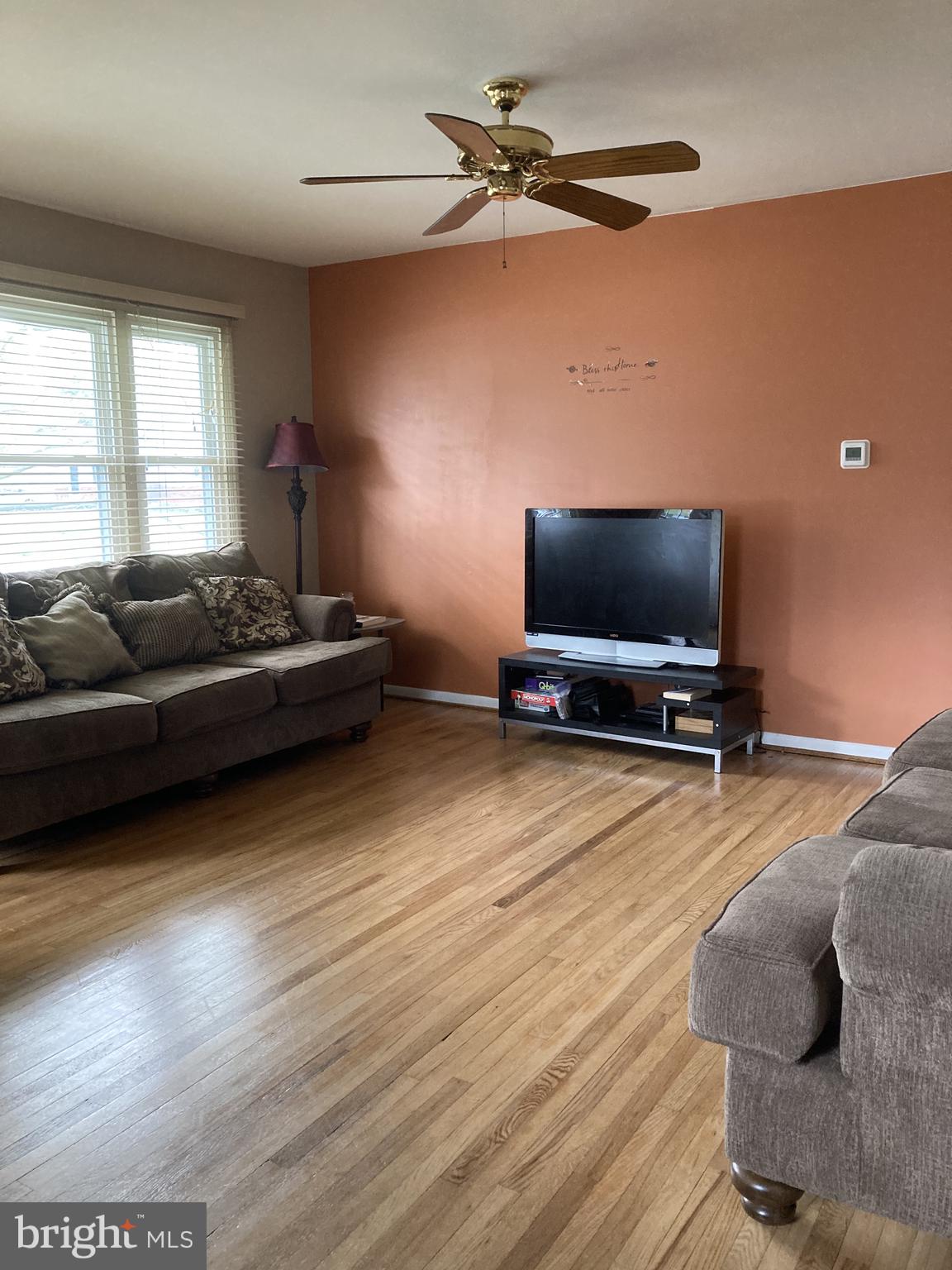 22 Old Manor Road Newark, DE 19711 - Photo 3 of 6 Sunny living room with hardwood floors