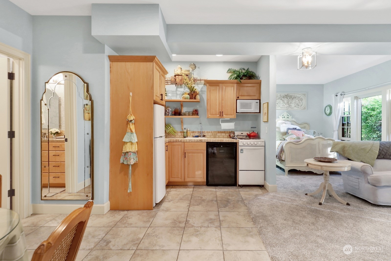 329 Bayside Road Bellingham, WA 98225 - Photo 25 of 40 a kitchen with stainless steel appliances kitchen island granite countertop a refrigerator and a sink
