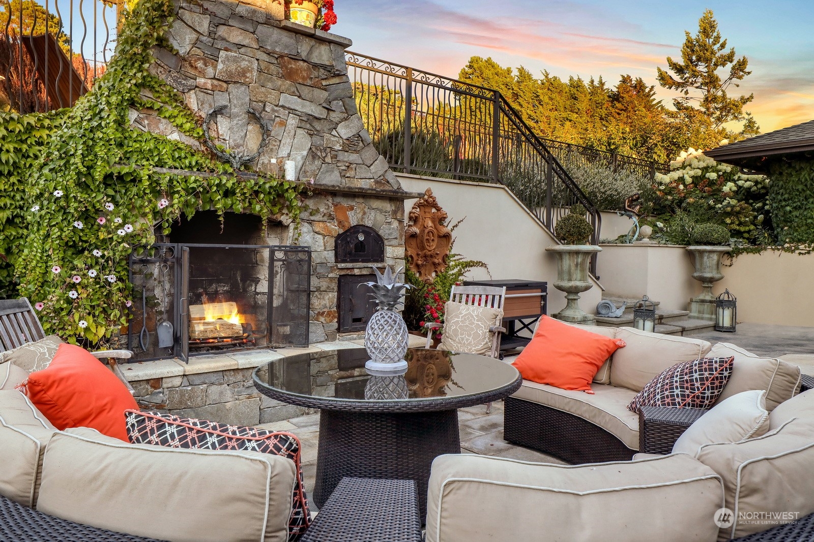 329 Bayside Road Bellingham, WA 98225 - Photo 32 of 40 a outdoor living space with furniture and a fireplace