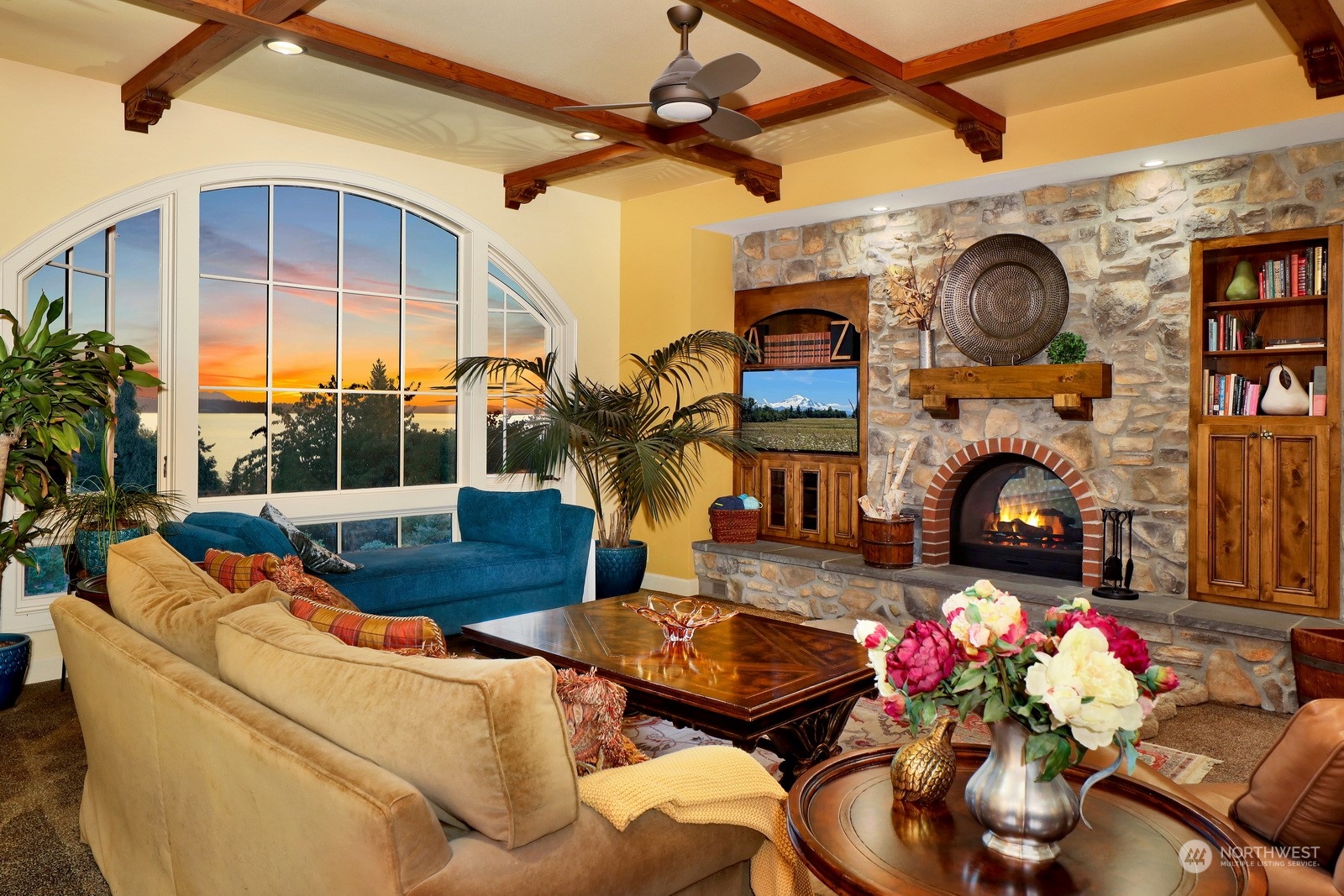 329 Bayside Road Bellingham, WA 98225 - Photo 10 of 40 a living room with furniture a fireplace and potted plants
