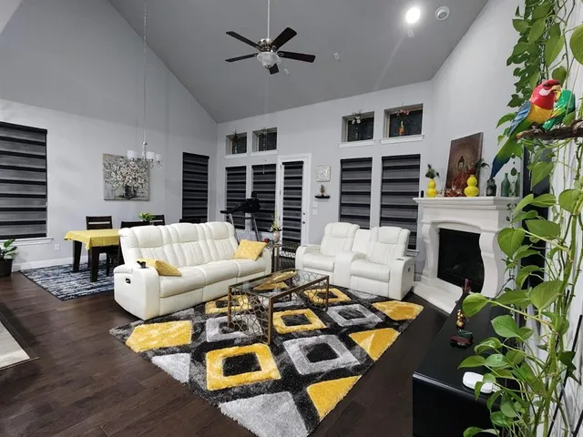 a dining room with furniture and a chandelier