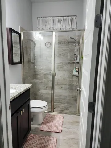 a bathroom with a sink and a shower