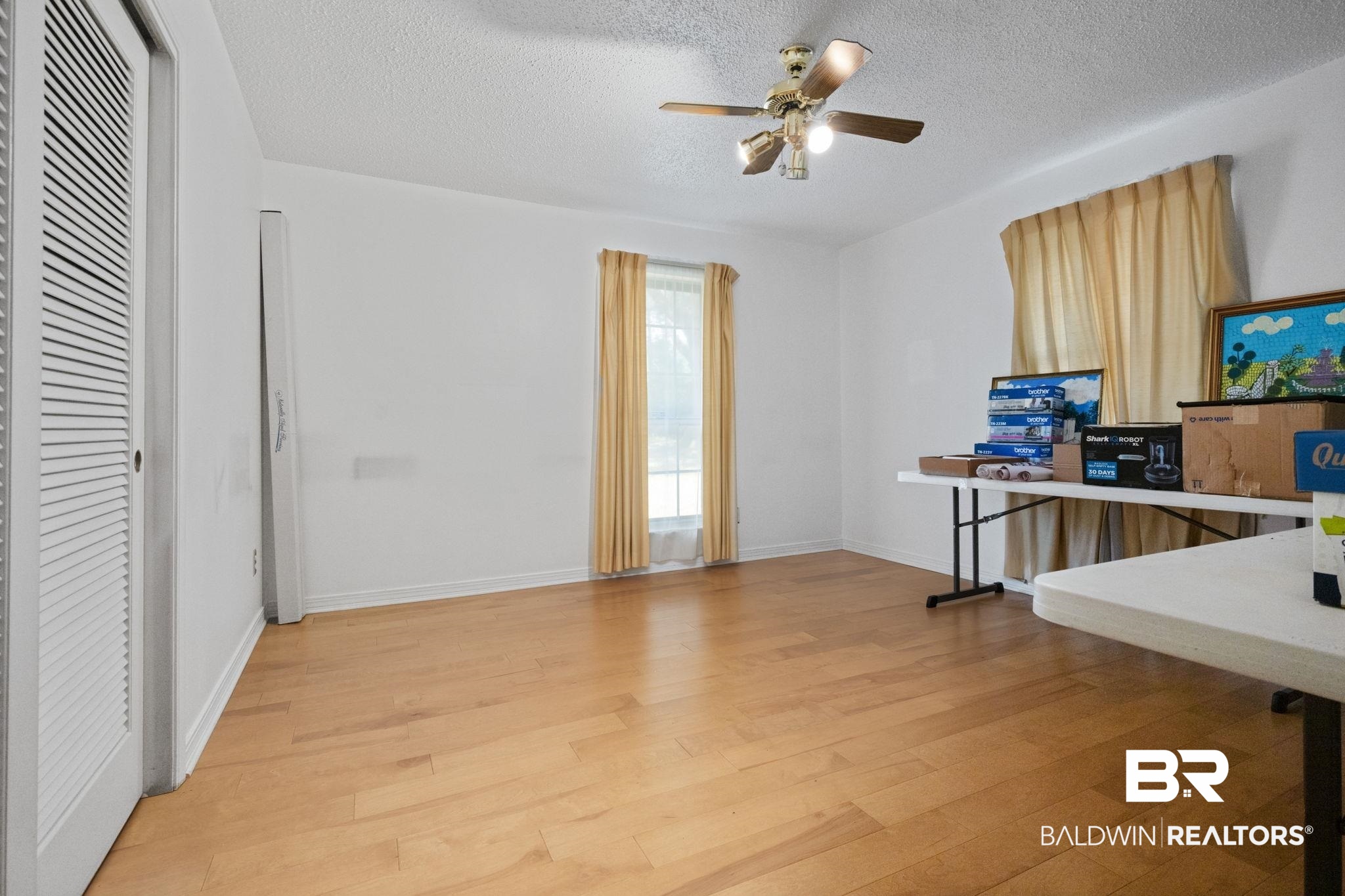 6261 Old Pascagoula Road Theodore, AL 36582 - Photo 24 of 29 Interior space with ceiling fan, light hardwood / wood-style flooring, and a textured ceiling