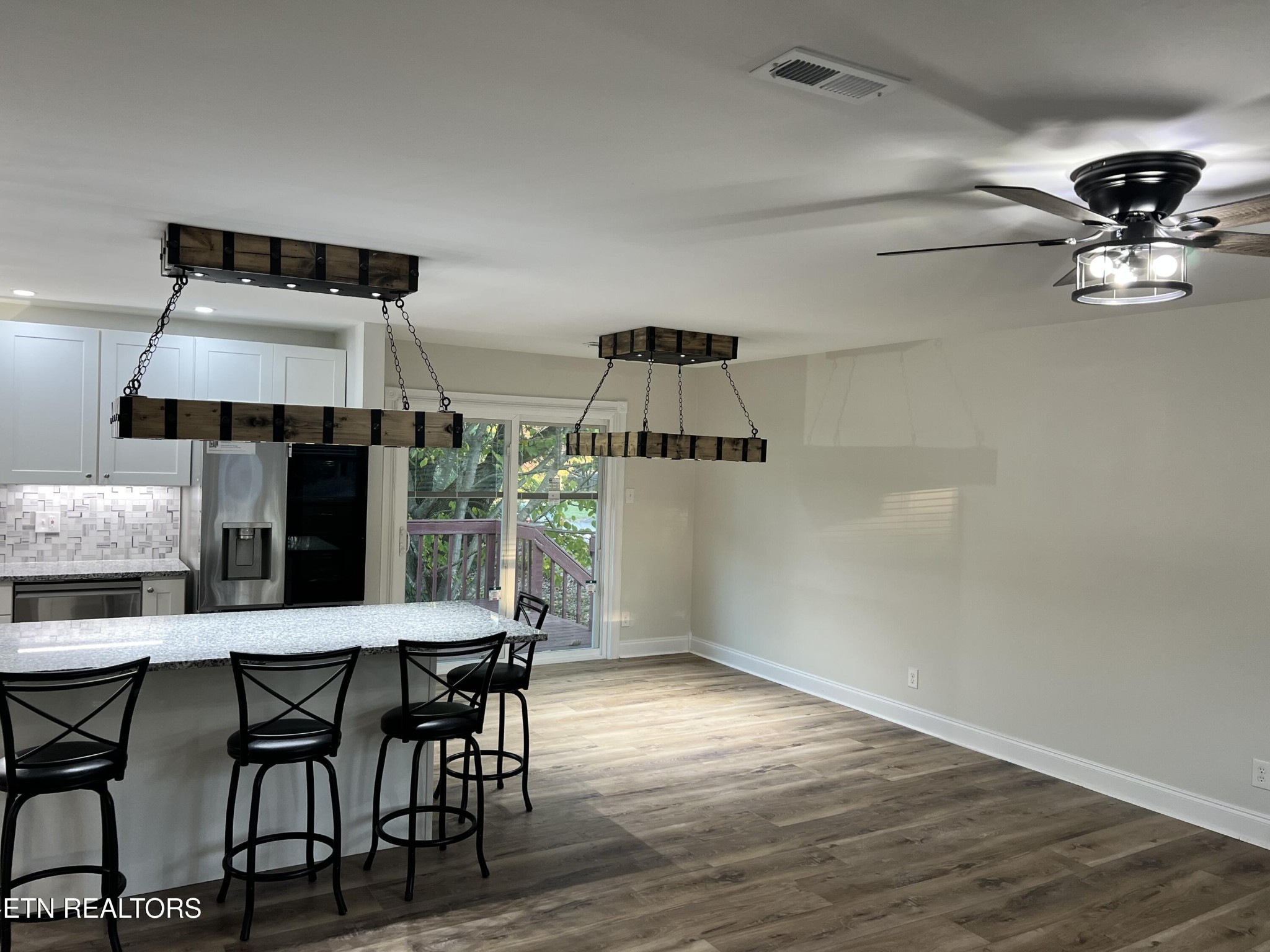 244 Peterson Road Knoxville, TN 37934 - Photo 15 of 46 a view of a dining room with furniture and wooden floor
