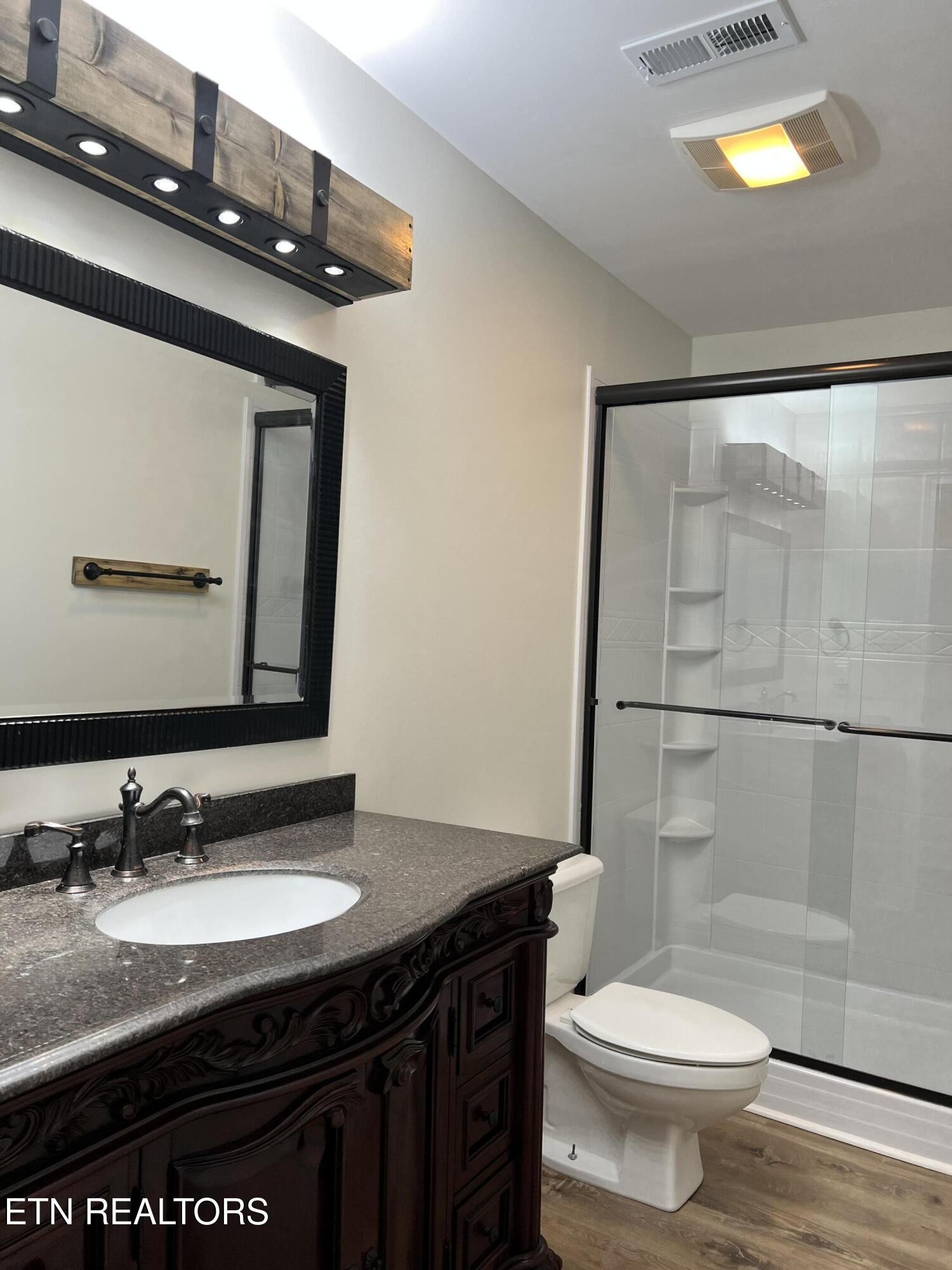 244 Peterson Road Knoxville, TN 37934 - Photo 17 of 46 a bathroom with a granite countertop sink toilet and mirror