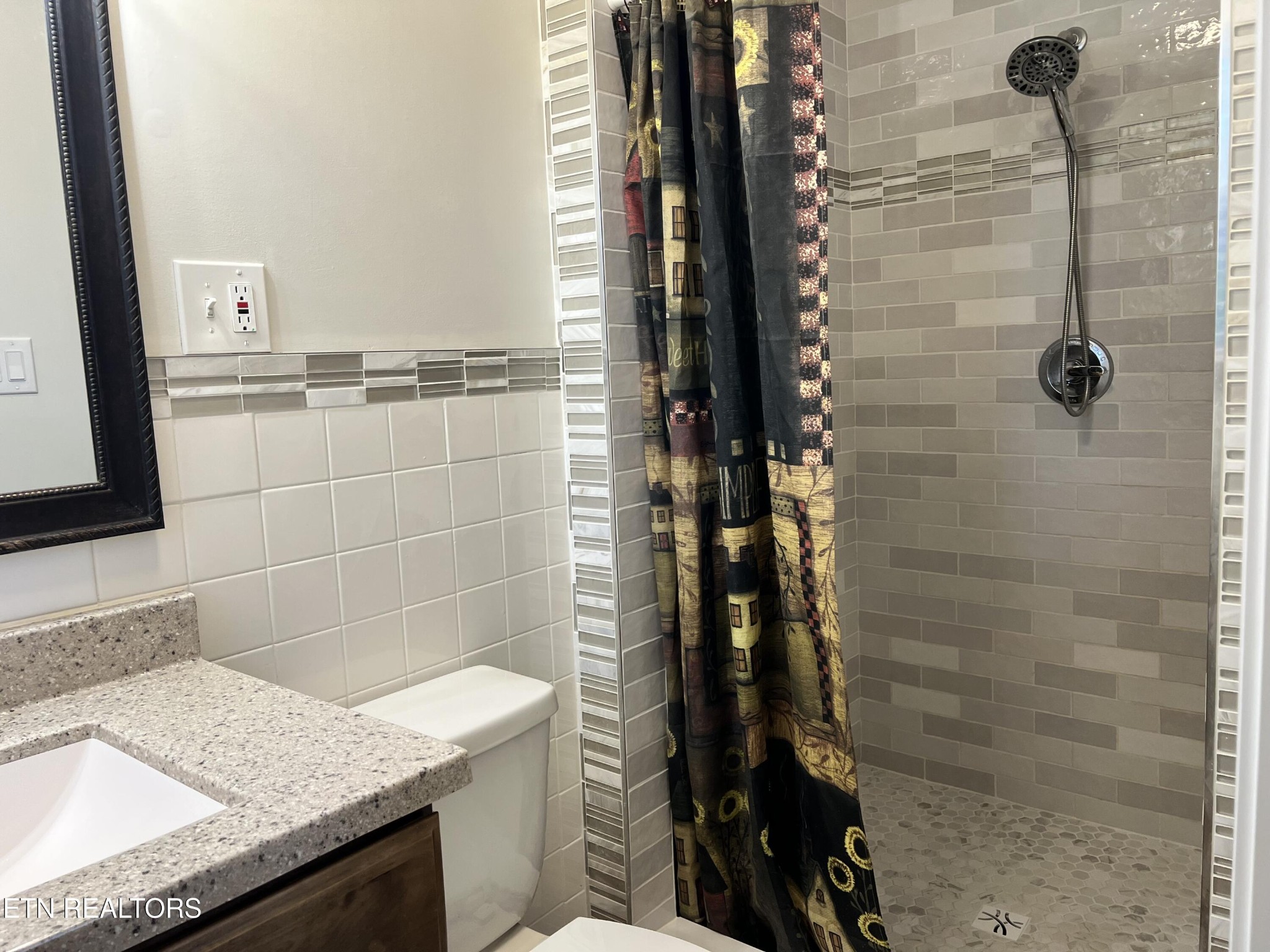 244 Peterson Road Knoxville, TN 37934 - Photo 20 of 46 a bathroom with a granite countertop shower and a sink