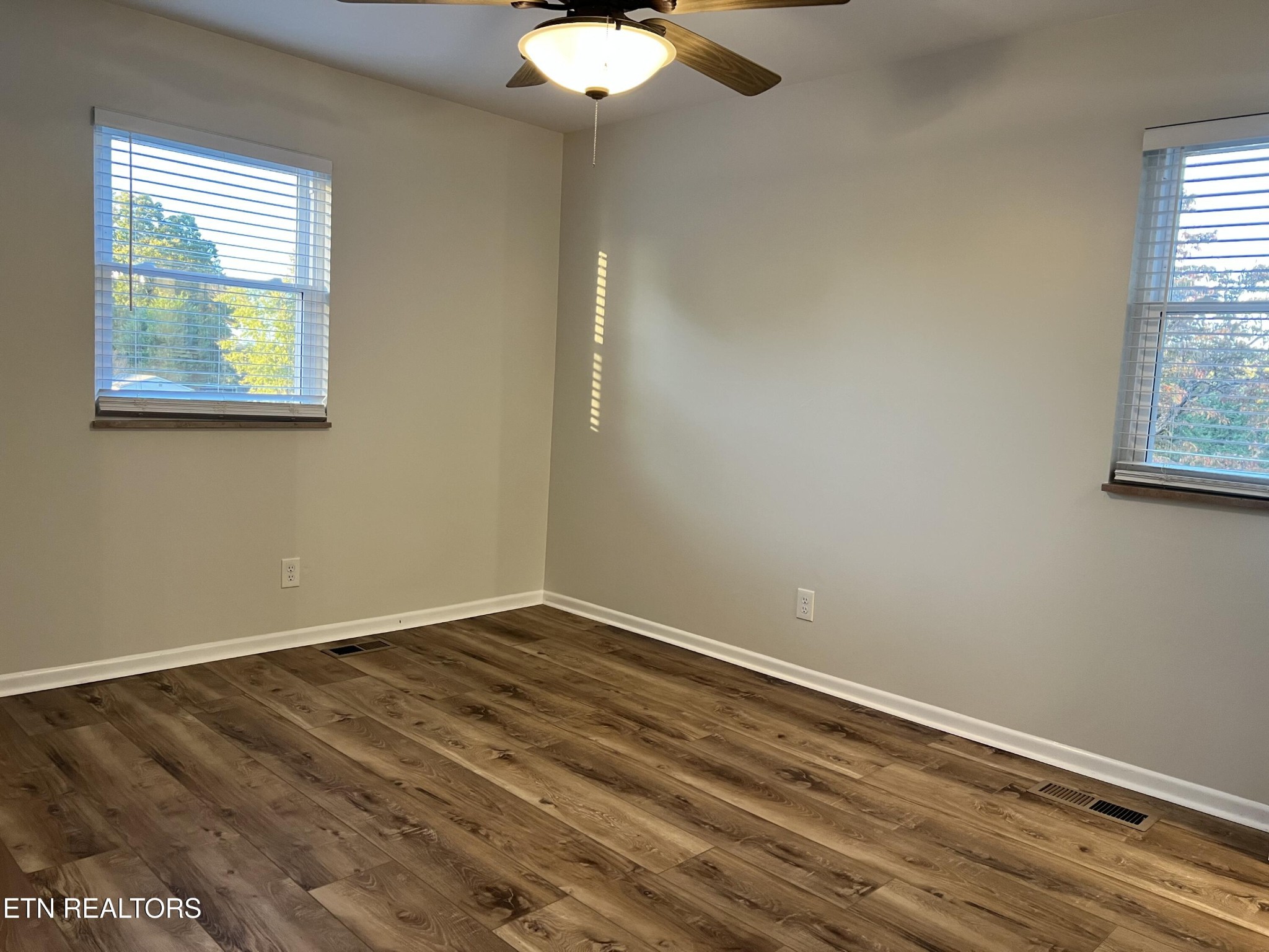 244 Peterson Road Knoxville, TN 37934 - Photo 25 of 46 a view of an empty room with wooden floor and a window