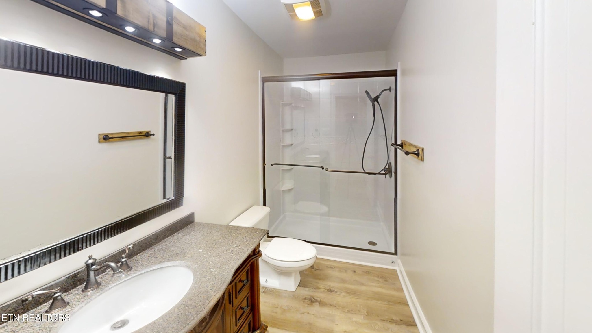 244 Peterson Road Knoxville, TN 37934 - Photo 3 of 46 a bathroom with a granite countertop sink toilet and shower
