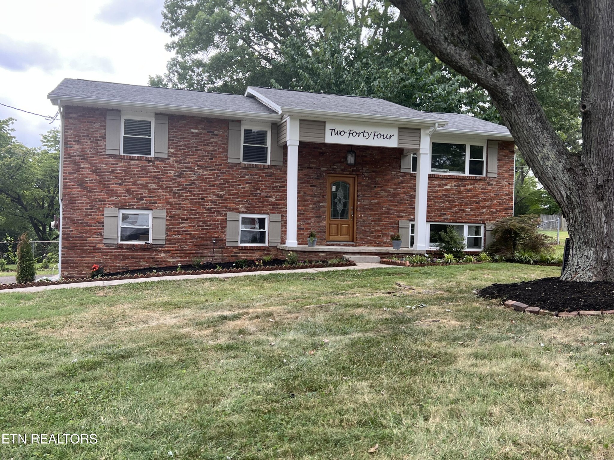 244 Peterson Road Knoxville, TN 37934 - Photo 37 of 46 a front view of a house with a yard