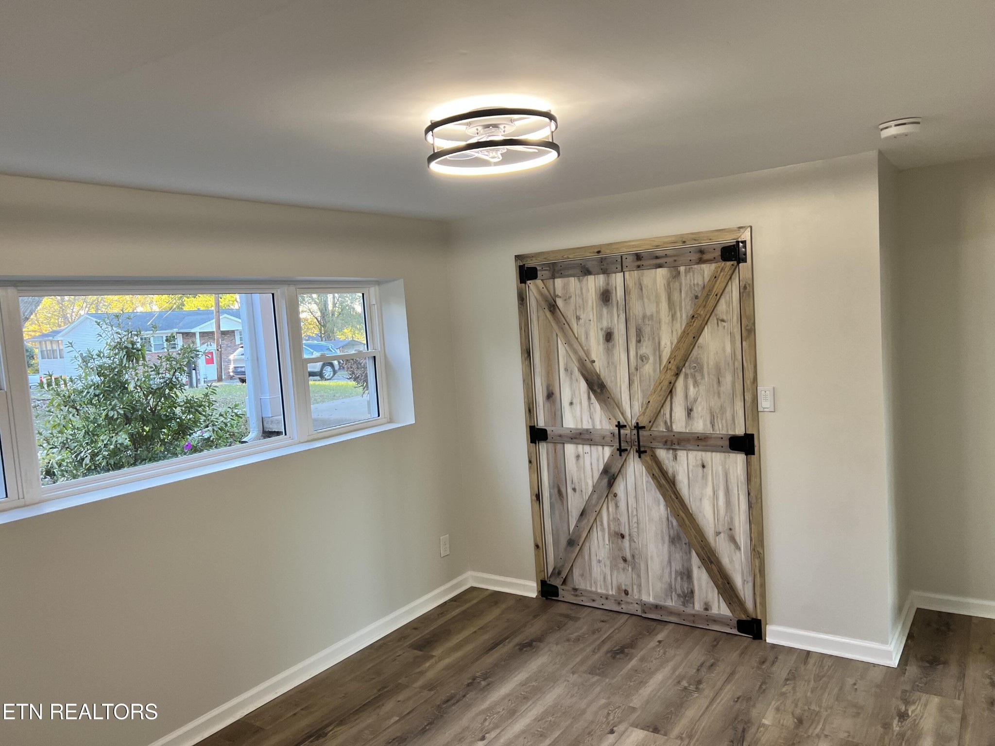 244 Peterson Road Knoxville, TN 37934 - Photo 39 of 46 wooden floor in an empty room with a window