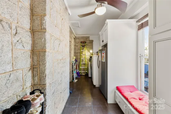 a hallway with kids room with couch