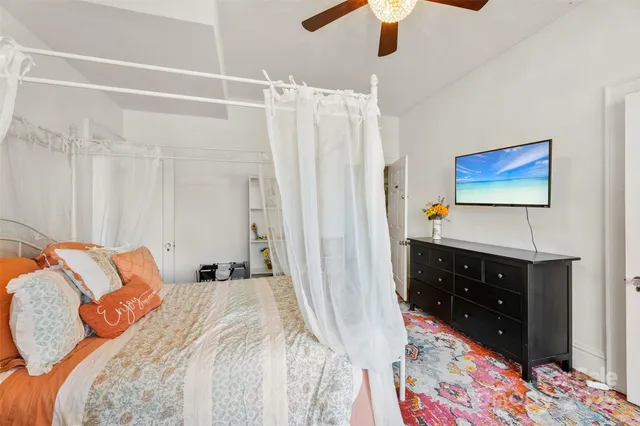 a bedroom with a bed and a dresser