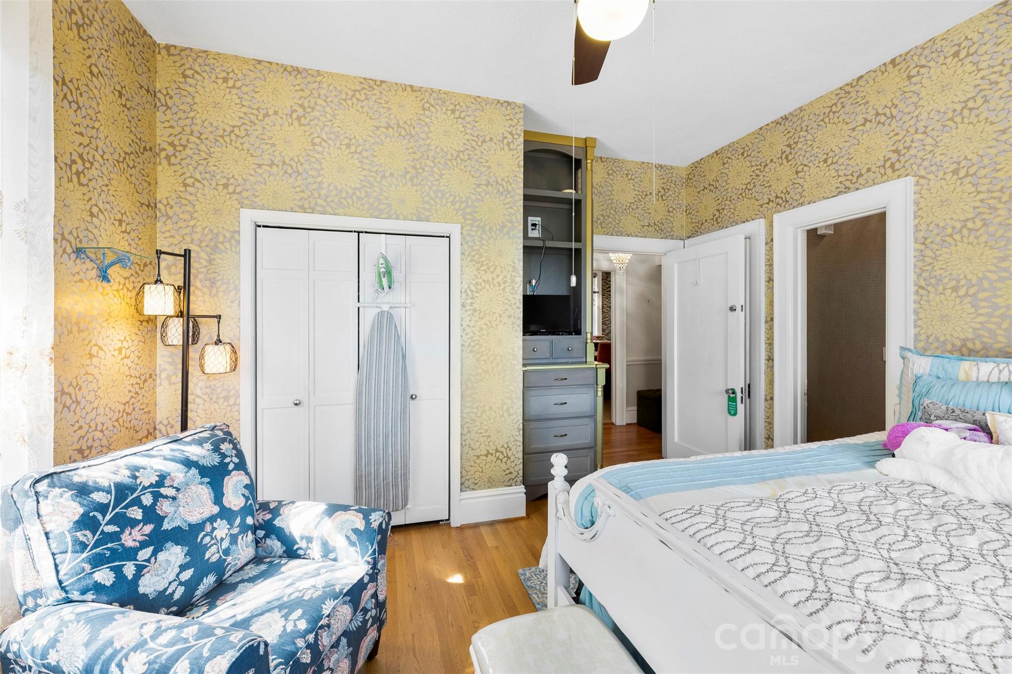 705 West Main Street Albemarle, NC 28001 - Photo 18 of 39 a bedroom with a bed and wooden floor