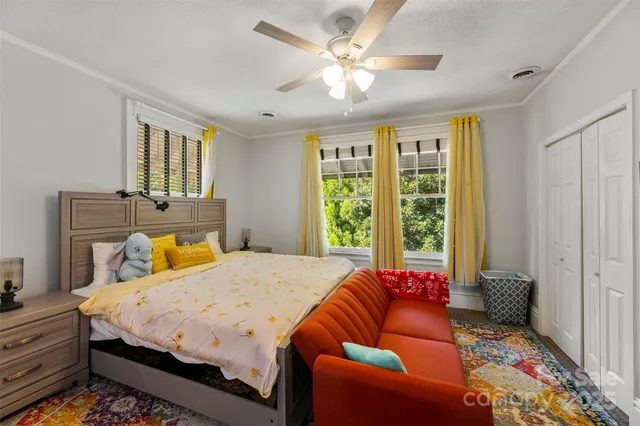 a bed room with a bed and a couch