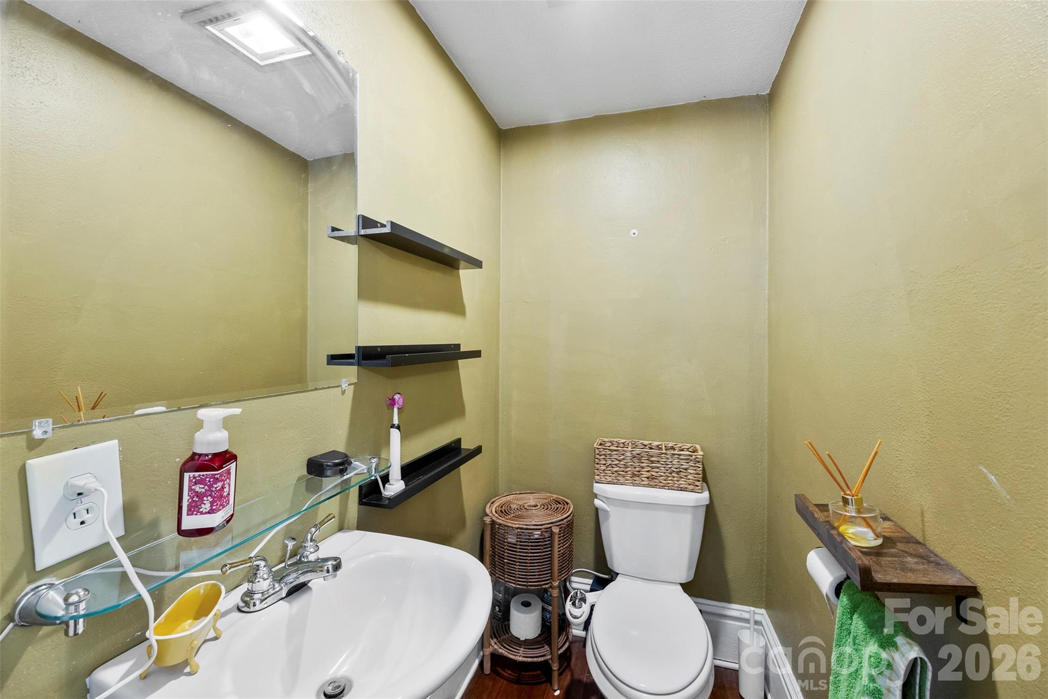 705 West Main Street Albemarle, NC 28001 - Photo 23 of 39 a bathroom with a toilet and a sink