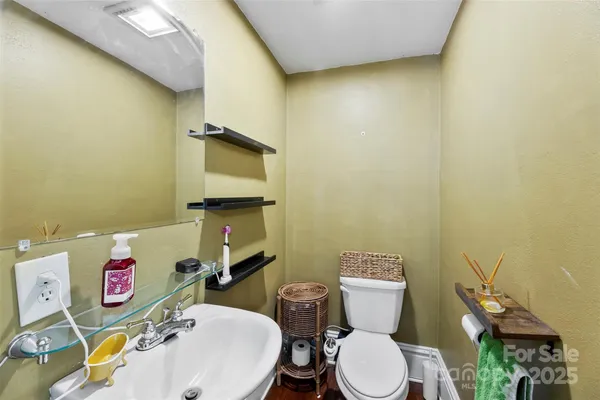 a bathroom with a toilet and a sink