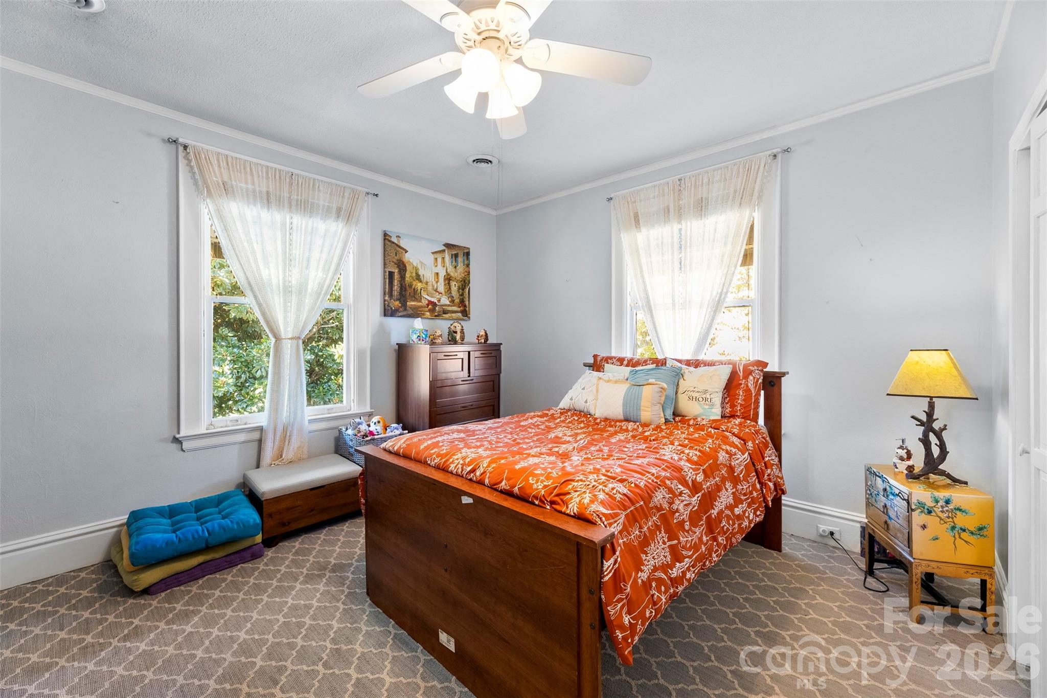 705 West Main Street Albemarle, NC 28001 - Photo 24 of 39 a bedroom with a bed and a chandelier