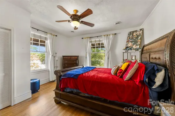 a bed room with a bed and a window