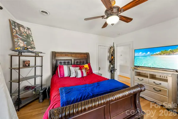 a bathroom with a toilet and a shower curtain