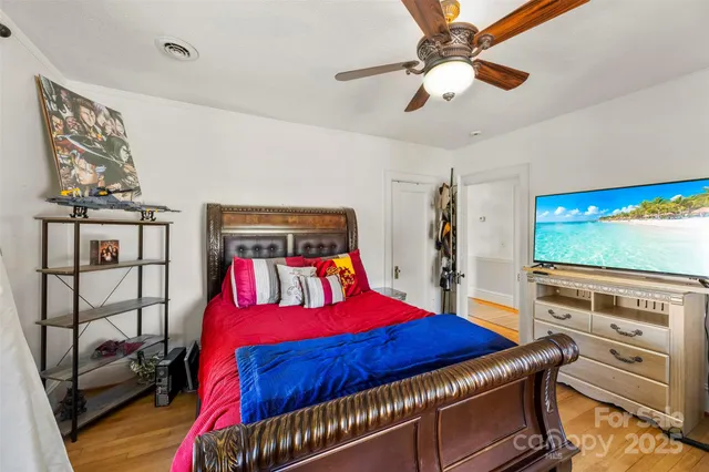 a bed room with a bed and a window