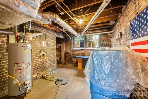 a living room with furniture and large windows