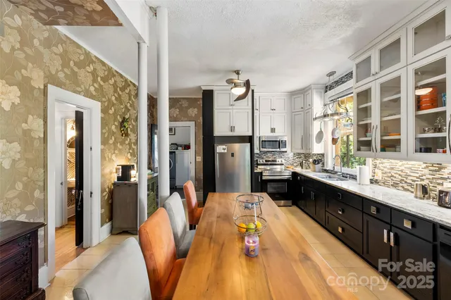 a large bathroom with a tub double sink and a mirror