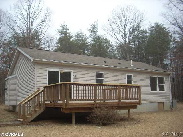 1728 Buckner Road Bumpass, VA 23024 - Photo 3 of 4 a view of a house with a yard and deck