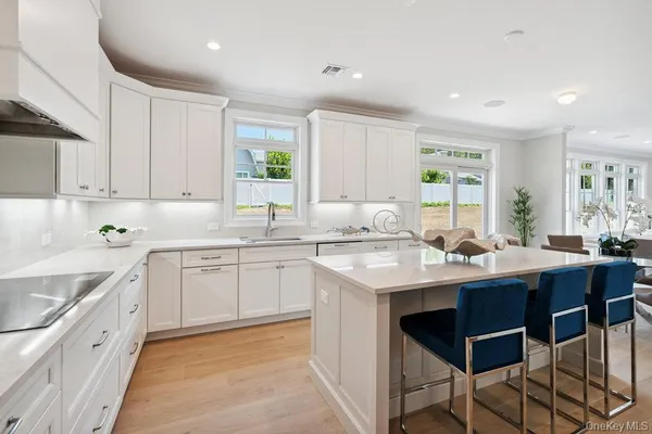 a kitchen with appliances a sink and cabinets