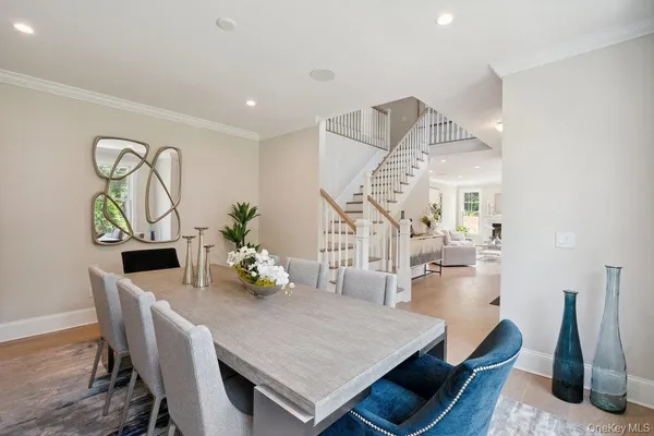 a dining room with furniture and wooden floor