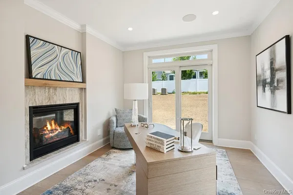 a living room with furniture a window and a fireplace